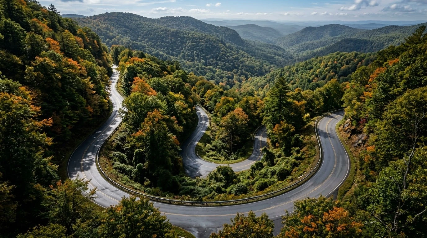 Rattlesnake Trail motorcycle ride guide showing a tight winding mountain backroad with technical curves in Virginia.